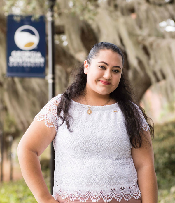 Alejandra Gonzalez-Galan standing in front a Georgia Southern sign outside