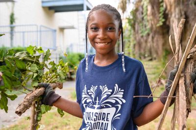 young volunteer holding debris