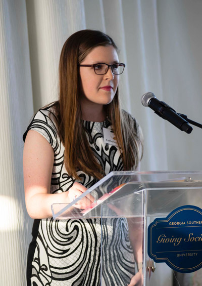 Barrs speaking at an event
