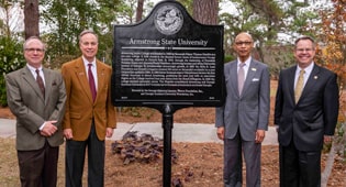 Georgia Historical Society President W. Todd Groce; Regent Don Waters; Former Savannah mayor and alumnus Otis Johnson; Georgia Southern President Kyle Marrero in front of the Armstrong Historical Marker