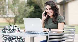 Jaqueline Miranda makes phone calls to senior adults as part of the Senior Companion Program.