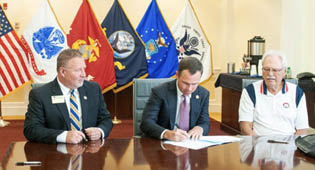 Pictured are (L to R): Vice President for Enrollment Management Scot Lingrell, Vice President for University Advancement Trip Addison and The Landings Military Family Relief Fund Inc. Board of Directors Chairman Bob Longueira