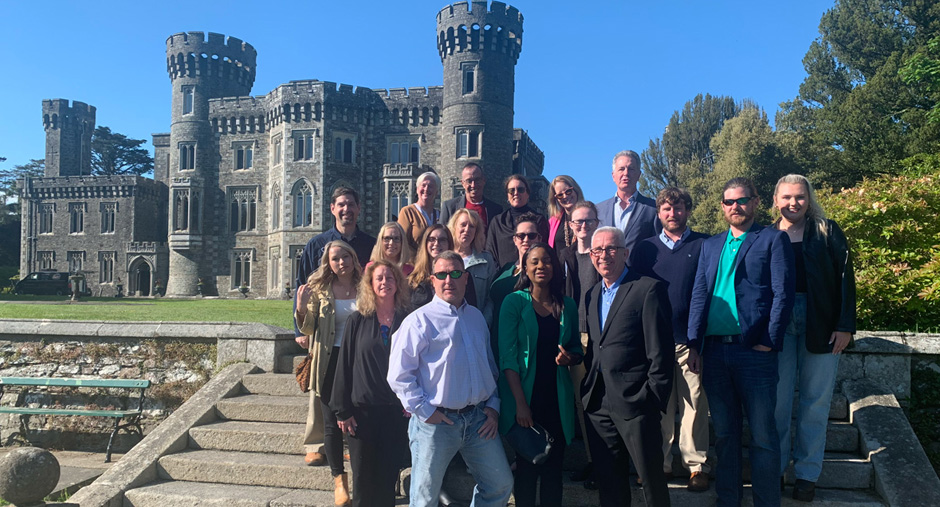 Alumni group stands in front of the Wexford Center