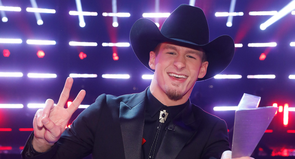 Bryce Leatherwood holds trophy from The Voice