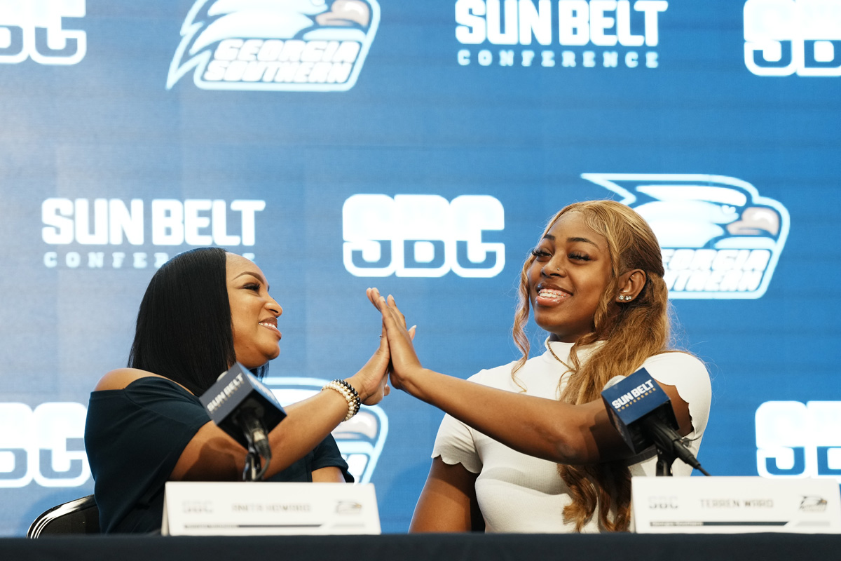 Coach Howard and player Terren Ward high five