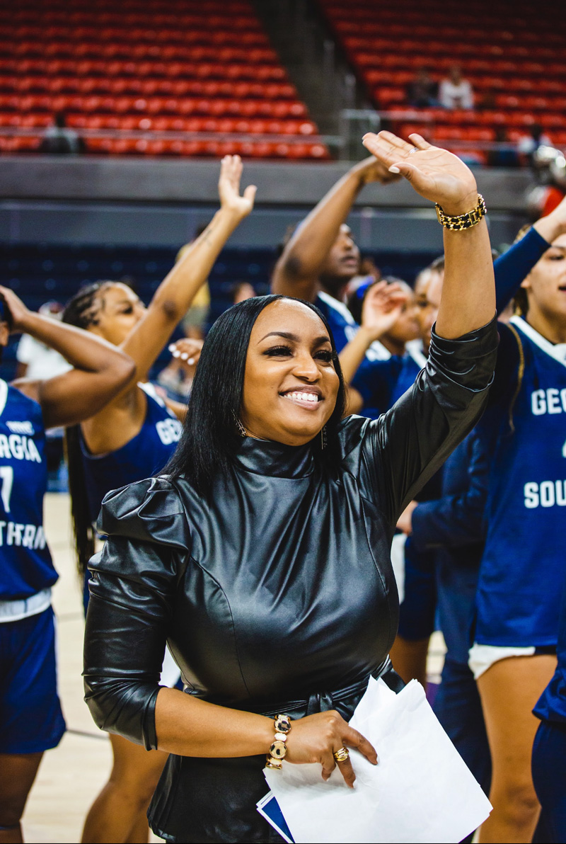 Coach Anita Howard waves to crowd