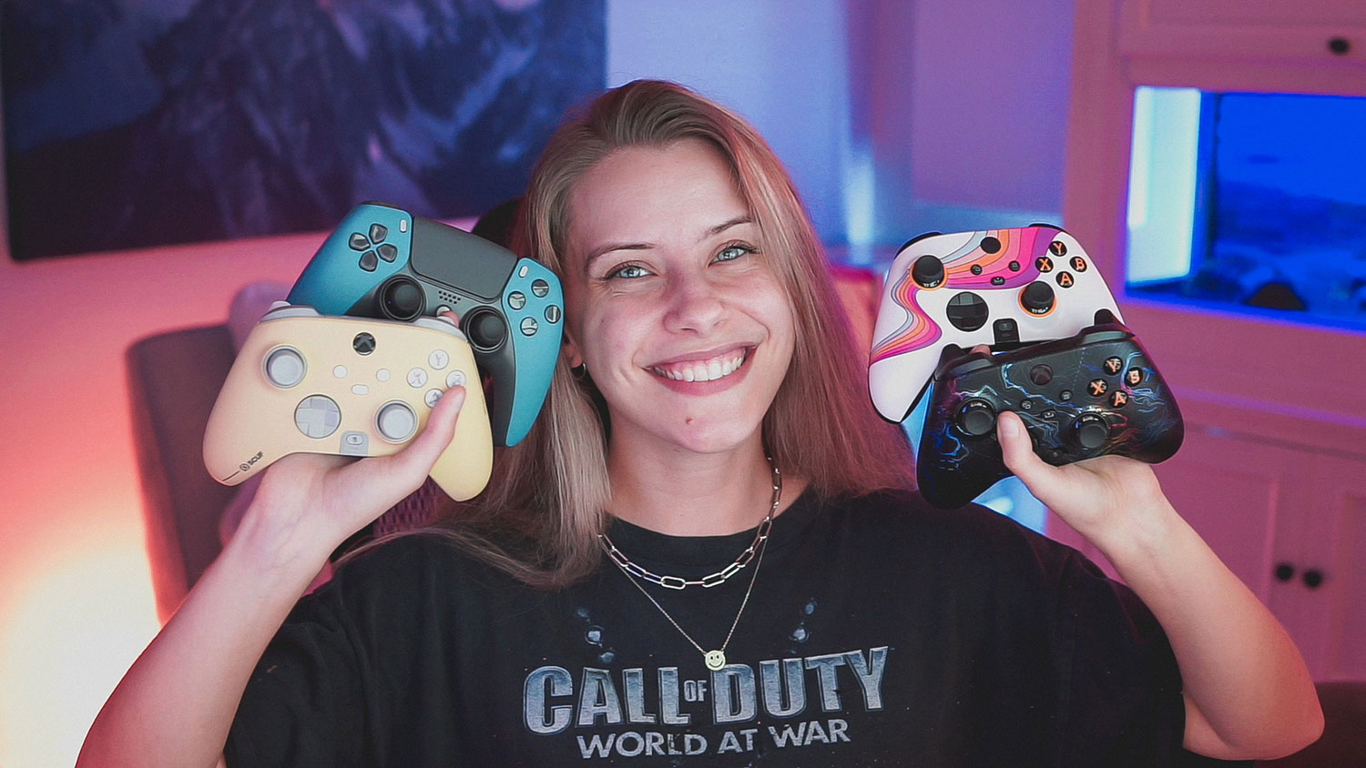 Hannah Bryan, aka Noisy Butters hold several game controllers