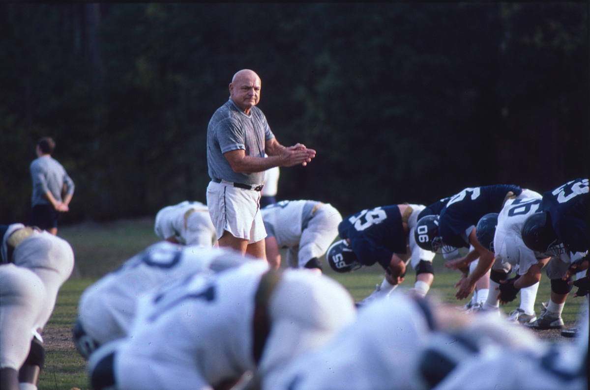 Erk Russell coaching Georgia Southern football players during practice.